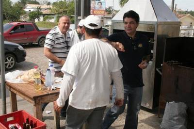 Salvaro e Márcio visitam empresa e comerciantes
